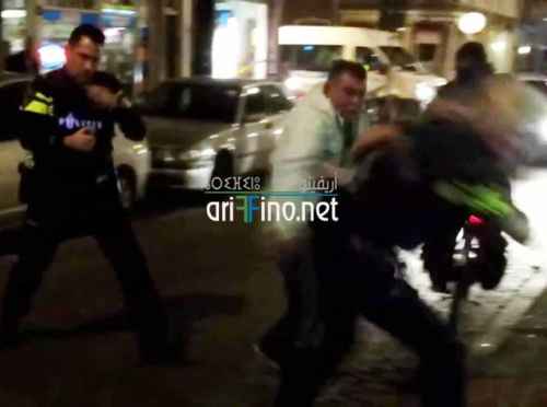 شاهد الصور و الفيديو: معركة شرسة بين مهاجر مغربي و الشرطة الهولندية في روتردام بسبب بوق سيارة
